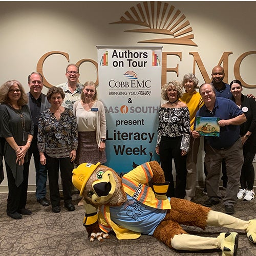 Cobb EMC and Gas South Literacy Week authors with mascot
