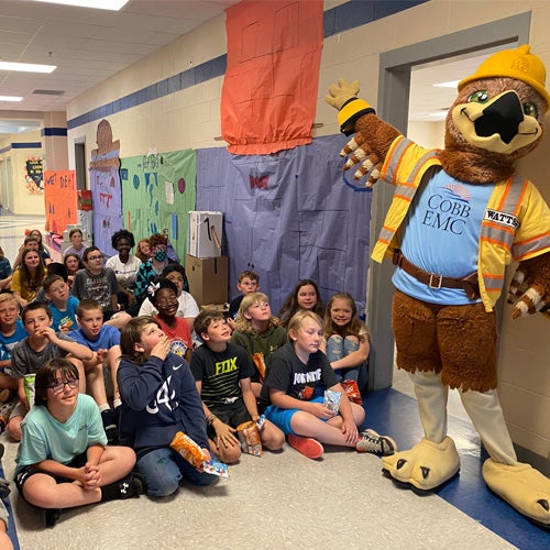 Students in school with mascot