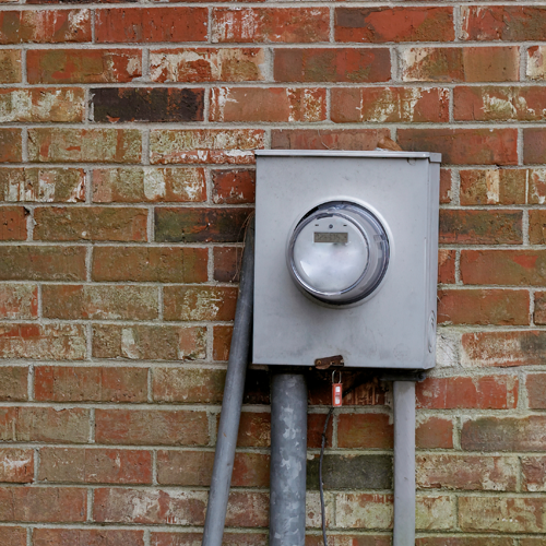 electric meter on brick wall